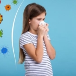 Little,Girl,With,Tissue,Sneezing,On,Light,Blue,Background.,Immunity