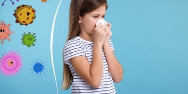 Little,Girl,With,Tissue,Sneezing,On,Light,Blue,Background.,Immunity