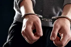 offender-with-his-hands-in-handcuffs-s6gi-vk-u-e-fg